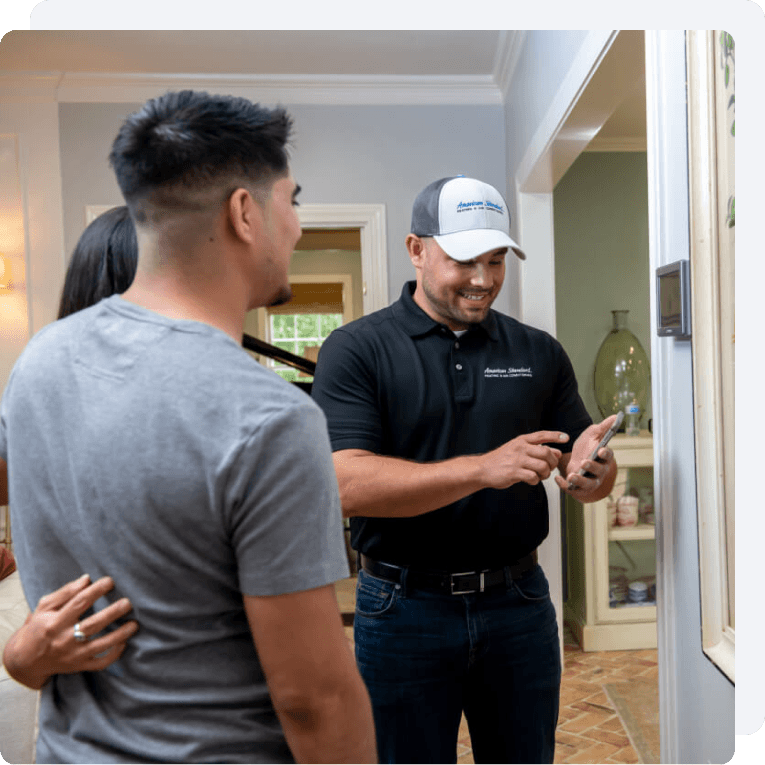 An HVAC dealer demos the thermostat app technology.